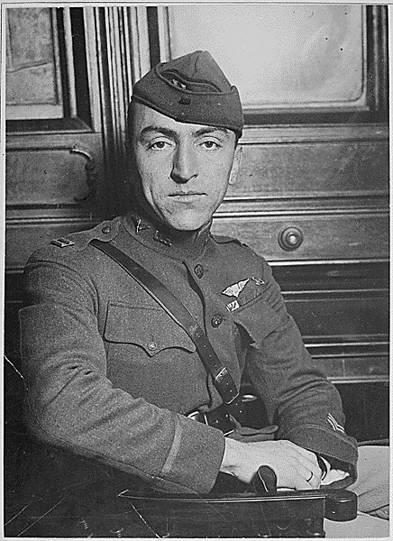 Captain Edward Rickenbacker, America's premier "Ace" officially credited with 22 enemy planes and the proud wearer of the French War Cross as he appeared upon his arrival on board the Adriatic, ca. 1919. Photo Credit: Underwood and Underwood/National Archives