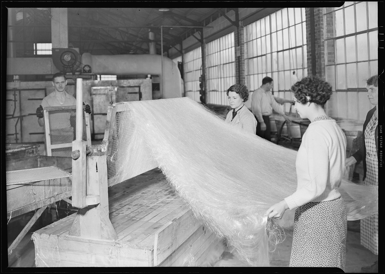 Frederick and Dimmock spinning glass wool at a factory in Millville, New Jersey on March 26, 1937. (Lewis Hine/WPA/History By Zim) Frederick and Dimmock spinning glass wool at a factory in Millville, New Jersey on March 26, 1937. (Lewis Hine/WPA/History By Zim)