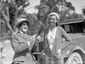 Ranger-naturalist Polly Patraw showing a foliage sample to visitor by an automobile around the East Rim of the Grand Canyon, June 1931. Photo Credit: Collins/Grand Canyon NPS