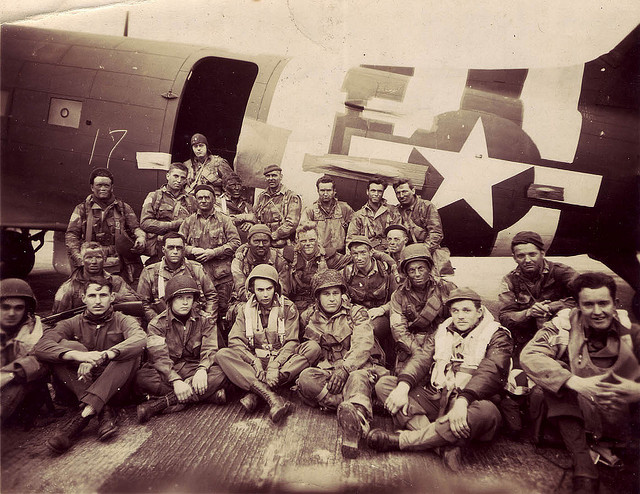 Chalk 17 poses for a photograph before departing for Normandy. This image shows the paratroopers and air crewmen of Pathfinder Team #2 of the 508th Parachute Infantry Regiment/82nd Airborne Division on the evening of Monday, June 5, 1944 shortly before taking off to go to France. They are posing in front of aircraft #42-93096, a Douglas C-47A that is in the collection of The National WWII Museum.