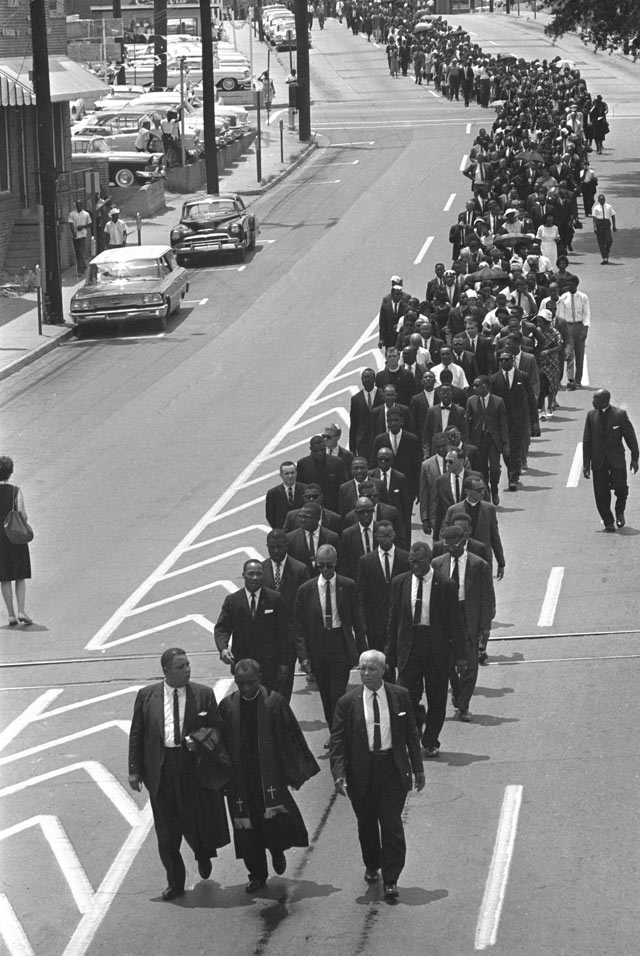 In this June 15, 1963, file photo, mourners march to the Jackson, Miss., funeral home following services for slain civil rights leader Medgar Evers. (Photo Credit: AP/ABC News) 