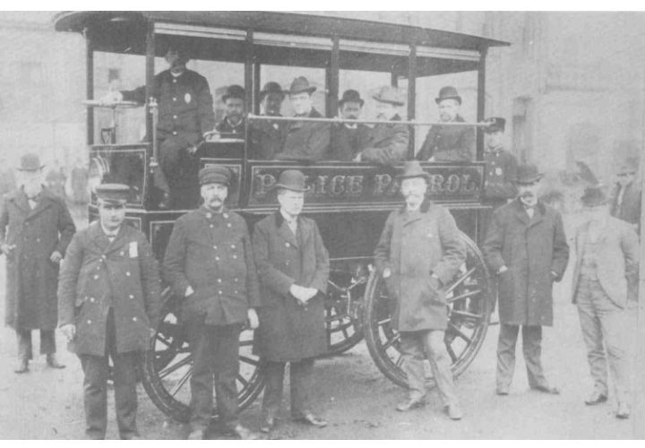 The term "squad car" likely came from early patrol days, when agencies used wagons to transport the whole squad. Photo Credit: Akron Police Department.